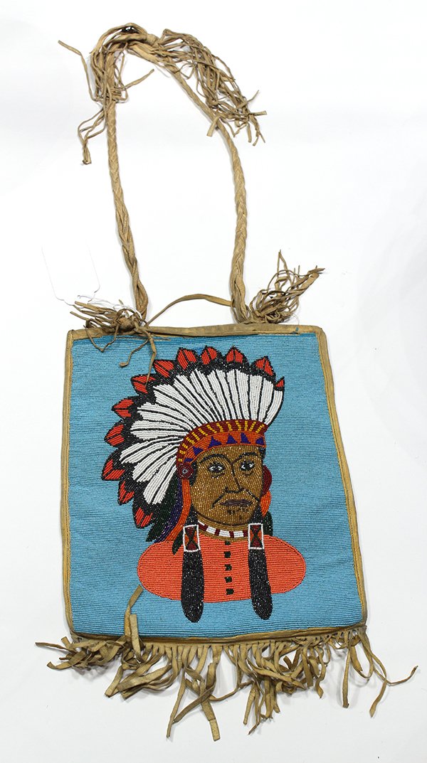 Nez Perce pictorial beaded flat bag: Nez Perce pictorial beaded flat bag, executed in glass beads and native tanned hide, depicting a man in a war bonnet on a blue ground, verso with stitched designs, and ending in fringe, retains braide