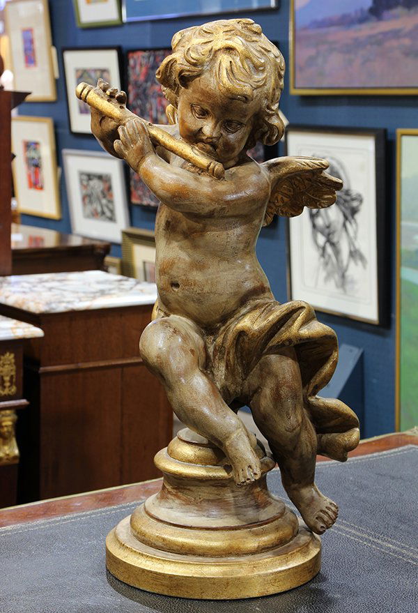 Italian Rococo style giltwood figure of a putto playing: Italian Rococo style giltwood figure of a putto playing a flute, depicted partially nude, draped in a robe, and rising on a graduated base, 20.5"h