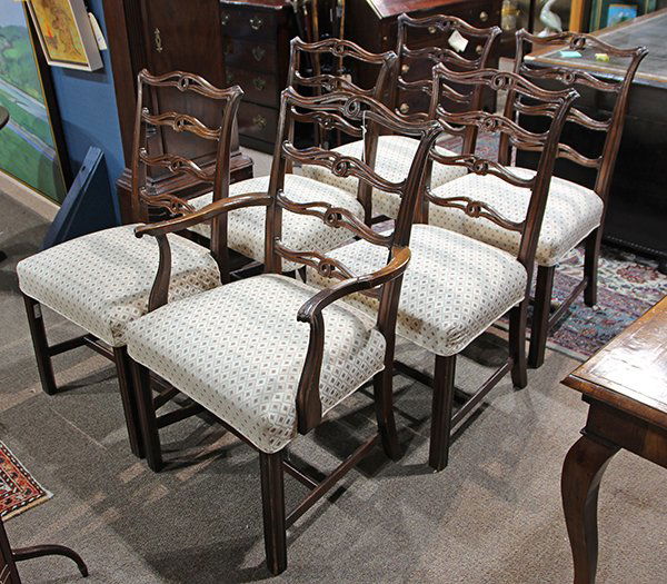 (lot of 6) Set of English mahogany dining chairs in the: (lot of 6) Set of English mahogany dining chairs in the Chippendale taste, late 19th/early 20th century, each with a pierced and shaped ladder back above an over upholstered seat, and rising on channe