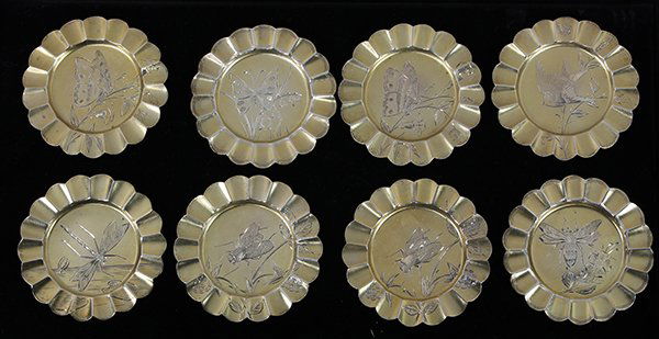 George S. Shreve sterling-gilt ruffle rim coasters: (lot of 8) George S. Shreve sterling-gilt butter pats, the ruflle rims framing a central engraving of a songbird, butterfly, or bumble bee, 3" diam., 5.98 troy oz.
