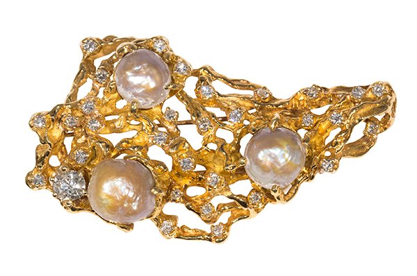 Diamond, cultured pearl and 18k yellow gold clip brooch: Diamond, cultured pearl and 18k yellow gold clip brooch set with one old mine cut diamond weighing approximately 1.00 ct., accented by full cut diamonds weighing a total of approximately 1.45 cts., an