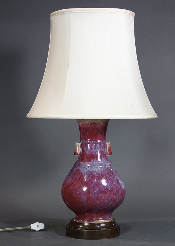 Chinese Flambe Glaze Vase/Lamp: Chinese flambe glazed vase, mounted as a lamp, of hu form with tubular handles flanking the neck and shoulder with raised bands, vase: 9.5"h, overall: 20.25"h. Provenance: From the Pittsburgh, PA esta