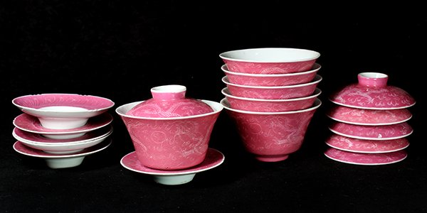 Chinese Pink Sgraffito Porcelain Cups: (lot of 6) Chinese pink sgraffito lidded porcelain cups with saucers, each of inverted bell form incised with a pair of dragons in pursuit of a jewel, the base with a Guangxu mark, the lid decorated e