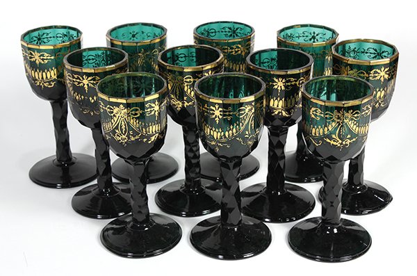(lot of 11) Moser style stemware in green, having a: (lot of 11) Moser style stemware in green, having a gilt border accented with ribbon swags, 6"h. Provenance: Thomas Livingston Antiques, San Francisco & Berkeley, CA