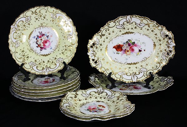 (lot of 10) English partial dinner service: (lot of 10) English partial dinner service, mid-19th century, each decorated with a pale yellow border surrounding a floral center, comprising (6) dinner plates, (2) oval serving plates and (2) circul