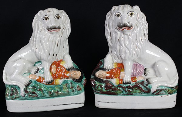 Pair of English Staffordshire pearlware figures, circa: Pair of English Staffordshire pearlware figures, circa 1865, depicting the British lion trampling on a recumbent figure of the French Emperor, Napoleon III, 9"h x 7.5"w. Provenance: From the Pittsburg