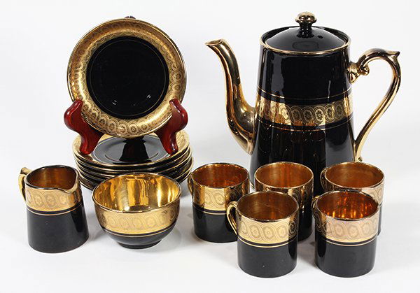 (lot of 9) English demitasse service, having a black: (lot of 9) English demitasse service, having a black glaze with a gilt border, consisting of a hot beverage pot, (5) cups with (6) saucers, cream and sugar, base marked Davenport