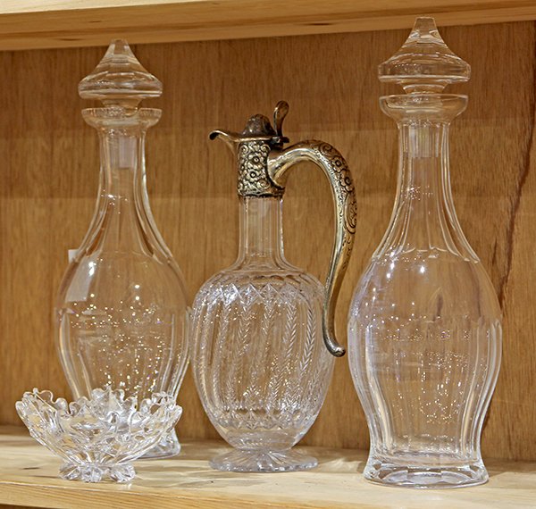 Waterford crystal stoppered decanters; sterling mounted: (lot of 4) Pair of Waterford crystal stoppered decanters of a tapering elegant form with clear flased accents; together with a sterling mounted crystal ewer, marked Theodore B. Starr (minor chip on ba