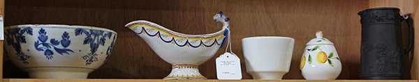 Continental porcelains: (lot of 5) Continental porcelains consisting of an Early Delft bowl with blue and white stylized flowers; French faience sauce boat; Wedgwood Etruria basalt pitcher decorated with a band of grape on v
