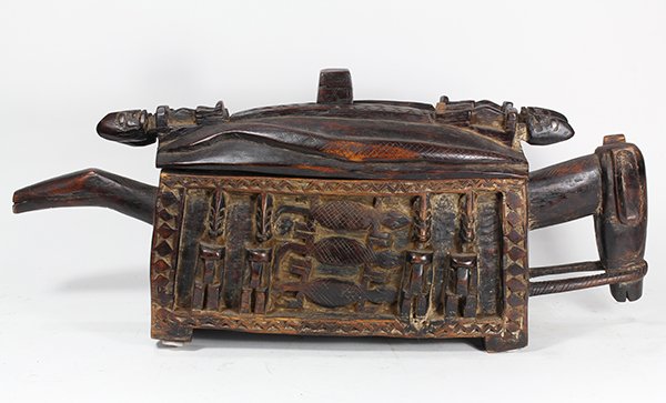 Dogon style, Mali, West Africa decorative covered: Dogon style, Mali, West Africa decorative covered trough, the figural carving depicting stylized indigenous figures, 12"h x 28"w x 6.5"d