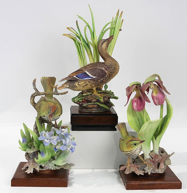 (lot of 3) Royal Worcester figural groups of birds and: (lot of 3) Royal Worcester figural groups of birds and flowers, executed in polychrome porcelain, comprising two Dorothy Daughty modeled examples 'Oven Bird and Lady Slipper Orchid; and 'Oven Bird and