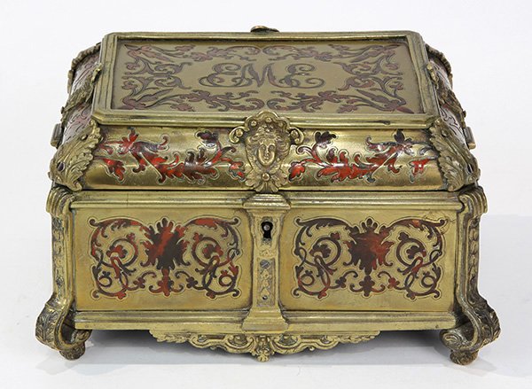 Napoleon III boulle decorated casket: Napoleon III boulle decorated casket, 19th century, the ornate top centering a monogram 'EME' with applied figural masks, and opening to a wood lined interior, the body having scrolling panels and str