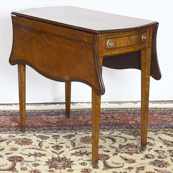 George III Pembroke table: George III Pembroke table, circa 1790, executed in rosewood, having a 'turtle' shaped top with satin wood cross-banding and centering a marquetry decorated partera, surmounting a working drawer and a 