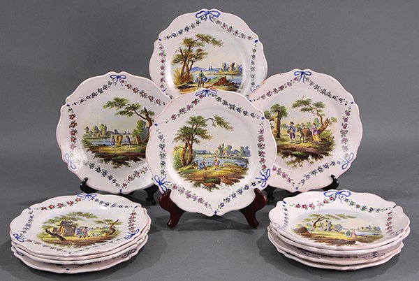 (lot of 12) French faience hand painted cabinet plates: (lot of 12) French faience hand painted cabinet plates executed by M. Clerc for Lille Faience, each having a hand painted scenic reserve flanked with bow and garland swags, underside marked with crown