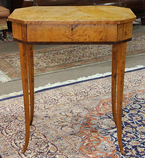 North European Biedermeier figured birch and fruitwood: North European Biedermeier figured birch and fruitwood work table, circa 1840, having an octagonal top, above a single drawer, having band inlay, and rising on tapered legs, 29.5"h x 25.5"w x 17"d. Pr