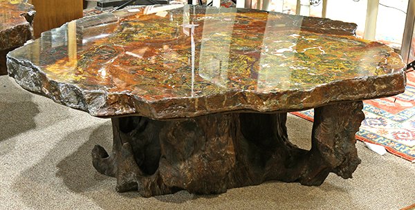 Mid Century petrified wood coffee table: Mid Century petrified wood coffee table, having a large slab top, and rising on a naturalistic base, 17.5"h x 54"w x 46"d