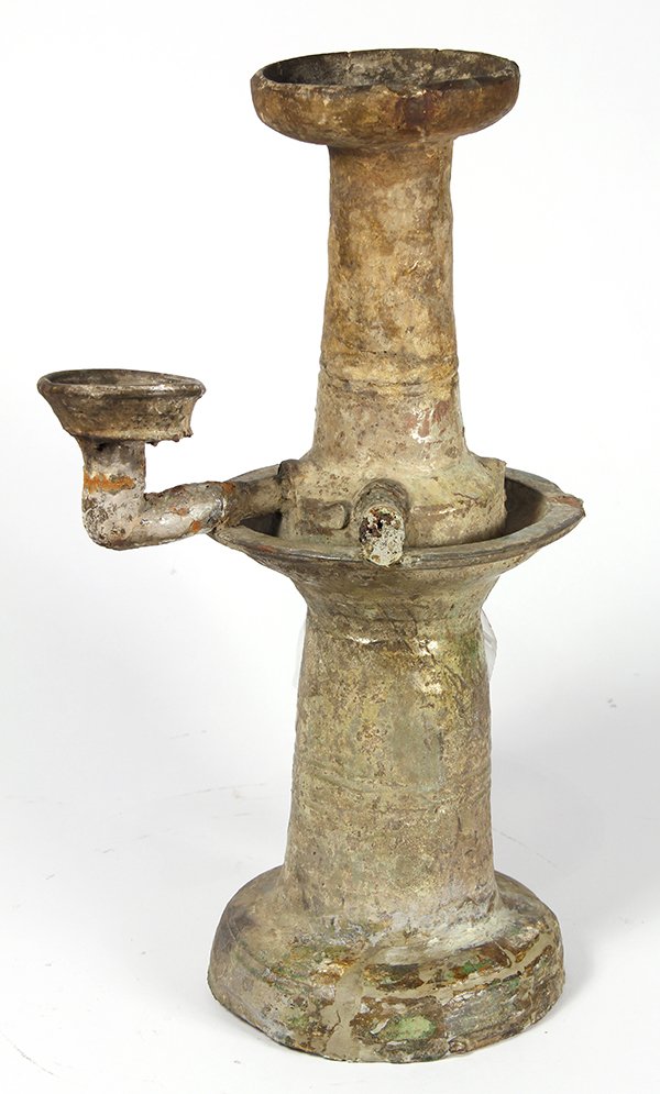 Chinese Han Green Glaze Oil Lamp: Chinese green glazed pottery oil lamp, Han dynasty, with a central column originally with four L shaped arms each supporting a small dish (repaired and losses), 17"h. Provenance: Deaccessioned by the 