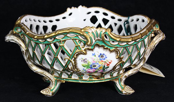 Old Paris porcelain reticulated basket: Old Paris porcelain reticulated basket, 19th century, in the Rococo taste, executed in green and white with gilt highlights, centering painted floral sprays, and rising on a footed base, marked "Rihou