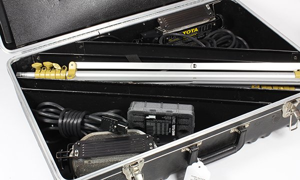Lowel Tota location light kit in fitted hard case: Lowel Tota location light kit in fitted hard case consisting of two Tota lights with mesh screen, two tripod stands, two cords with switches, umbrella, and a folded square frame
