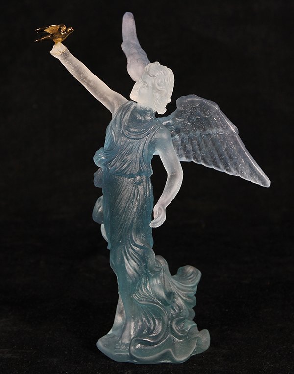 Daum France sculpture of an angel with a dove: Daum France sculpture of an angel with a dove, executed in blue ombre pate de verre, the angel having spread wings and one arm raised to hold a gilt dove, signed Daum France, with original box, 8"h x 