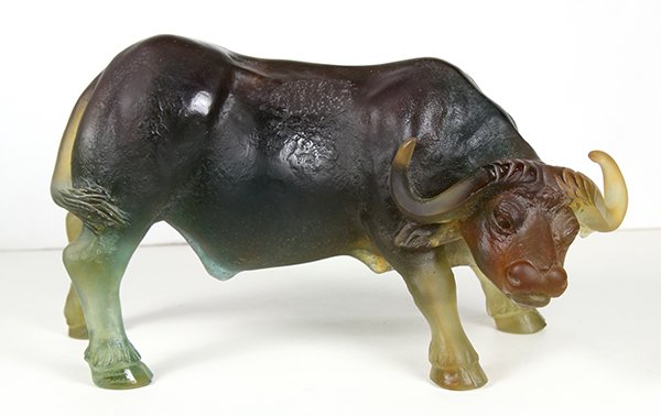Large Daum Water Buffalo sculpture: Large Daum Water Buffalo sculpture, executed in grey green an amber pate de verre, depicted with its head turned and signedDaum France on the back right hoof, with original box, 5.75"h x 10"l