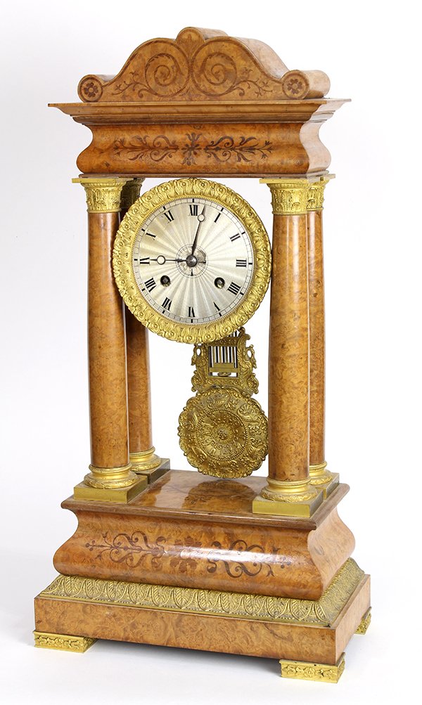 Biedermeier marquetry inlaid portico clock: Biedermeier marquetry inlaid portico clock, having a shaped cornice with scroll inlay, surmounting the Roman numeral dial captured in a gilt metal collar, flanked with four pilasters each having Corin