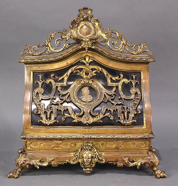 French Napoleon III ormolu mounted stationary stand,: French Napoleon III ormolu mounted stationary stand, circa 1870, the crest with central cabachon medallion flanked with scrolled accents, the case decorated with an applied bust of a nobleman, centere
