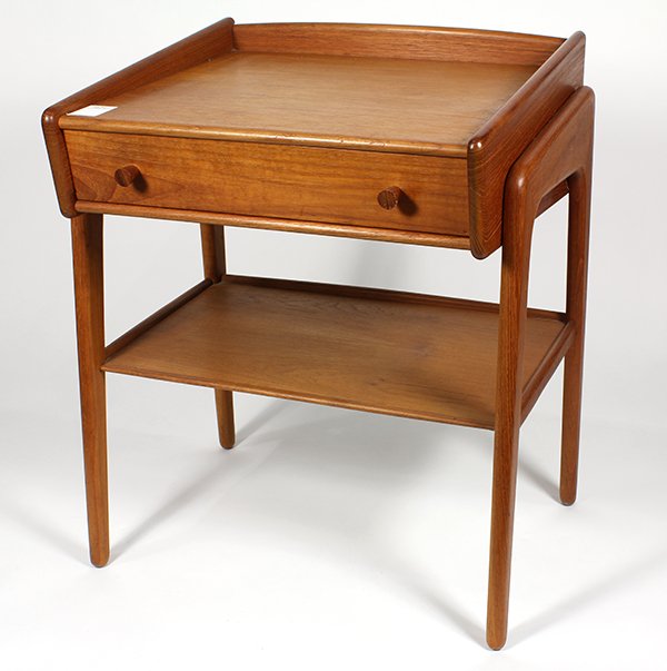 Danish Modern teak occasional table by Svend Madsen for: Danish Modern teak occasional table by Svend Madsen for Karl Lindegaard, having a rectangular top above a single drawer, continuing to the lower tier, 22"h x 19.5"w x 16"d