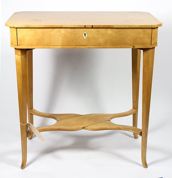 North European Biedermeier figured birch and fruitwood: North European Biedermeier figured birch and fruitwood work table circa 1840, having an octagonal top above the single drawer case, and rising on tapered legs conjoined by the lower tier, 28"h x 27.5"