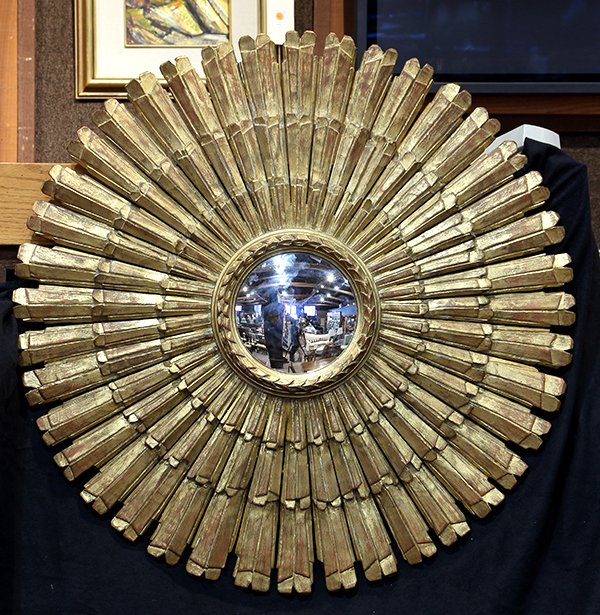 Mid Century giltwood carved starburst mirror: Mid Century giltwood carved starburst mirror, having a graduated border flanking the convex looking glass accented with a garland frieze, 36"w
