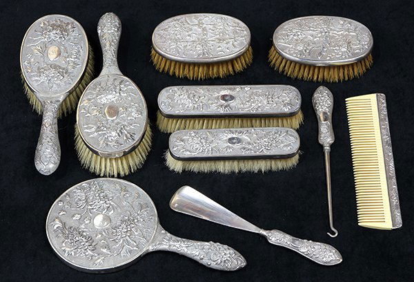 Chinese Export silver dresser/vanity set by Luen Wo: (lot of 10) Chinese Export silver dresser/vanity set consisting of two garment brushes, two hair brushes, hand mirror, button hook, shoe horn, by Luen Wo, Shanghai, late 19th/early 20th century, each