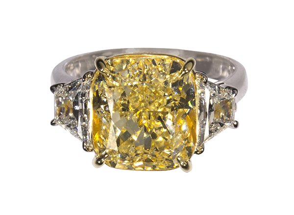 Yellow diamond and near colorless diamond ring: Yellow diamond and near colorless diamond ring centering one rectangular modified brilliant cut diamond weighing 7.52 cts., accompanied by a GIA Diamond Grading Report #1169129995, dated November 01, 