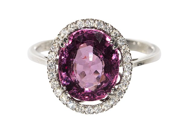 Spinel, diamond and 18k white gold ring: Spinel, diamond and 18k white gold ring centering (1) oval cut violetish pink spinel weighing approximately 4.38 cts., accented by full cut diamonds totaling approximately 0.25 ct., set in a halo desi