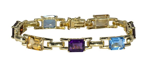 Multi-gem and 14k yellow gold bracelet: Multi-gem and 14k yellow gold bracelet highlighted by (2) citrines, (2) garnets, (2) blue topaz and (1) amethyst, all rectangular step cuts set in a panther link mounting, 7", weighs 18.9 grams