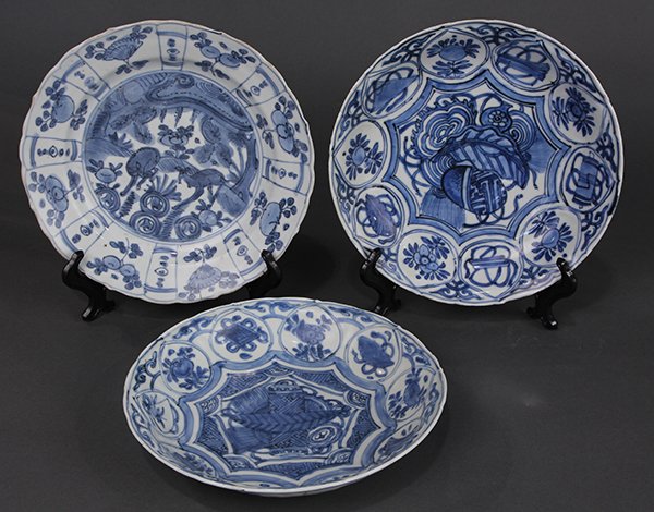 Chinese Blue and White Kraak Dishes: (lot of 3) Chinese underglaze blue porcelain Kraak dishes, Ming dynasty, 16th century, one featuring two deer in a landscape; the second and third with a scroll and leaf to the centers, surrounded by 