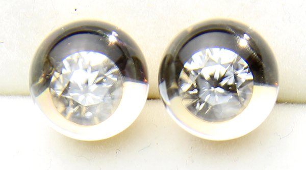 Pair of Mauboussin rock crystal, diamond and 18k yellow: Pair of Mauboussin rock crystal, diamond and 18k yellowhaving an optical illusion, featuring (2) small round diamonds magnified by crystal balls, mounted in 18k yellow gold mountings, la pousette back