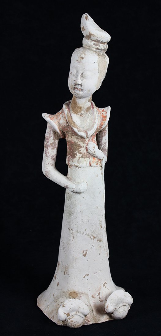 Chinese Tang Pottery Attendant: Chinese Tang pigment decorated pottery figure, the beauty with a tall chignon and head tilted to right, wearing a red vest and long dress, 14.5"h
