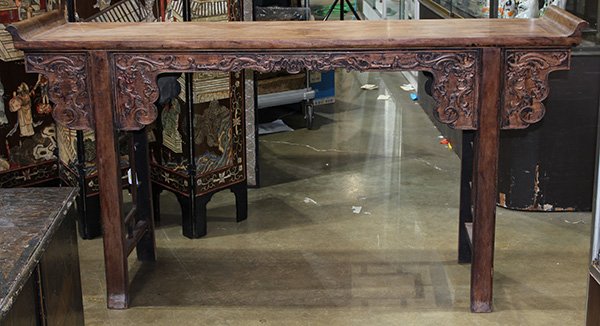 Chinese Hardwood Altar Table, Phoenix-Dragons: Chinese hardwood altar table, with a single panel floating top within a plain edge and with swallowtail terminals, the apron depicting gui-dragons and phoenix-dragons, raised on straight bead edge sup