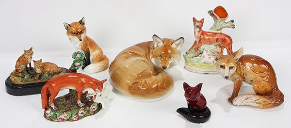 (lot of 7) One shelf of porcelain and pottery fox: (lot of 7) One shelf of porcelain and pottery fox figurines, including a seated fox by Royal Worcester, 7.5h x 3"w; a seated Flambe fox by Royal Doulton 4.5"h x 3.25"w and (2) Staffordshire figures, o