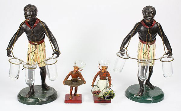(lot of 4) Pair of Continental Blackamoor figural: (lot of 4) Pair of Continental Blackamoor figural epergnes, executed in patinated and enameled metal, the standing figures of young man having rope harness encircling three glass vessels, and rising o