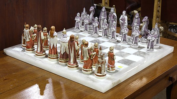 Moderne alabaster chess board, with polychrome: Moderne alabaster chess board, with polychrome decorated pieces by Nigri, dressed in Medieval attire, board: 21.5"dia.