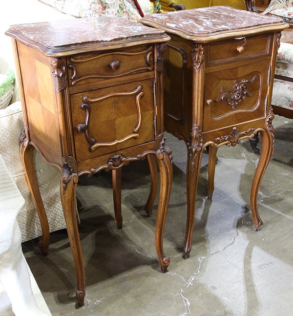 (lot of 2) Louis XV style marble top commodes, circa: (lot of 2) Louis XV style marble top commodes, circa 1880, each having an inset rouge marble top surmounting the panelled case having relief carved accents, and rising on cabriole legs, 34.5"h x 15"w.