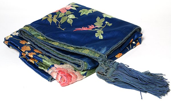 Embroidered silk piano shawl, having a polychrome: Embroidered silk piano shawl, having a polychrome floral medallion with tendrils on a sapphire blue ground, backed in brocade and having fringed tassels at the corners, 46"sq. Provenance: Property f