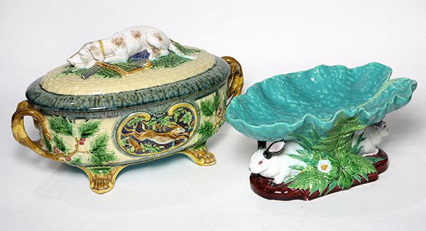 (lot of 2) 19th century Minton figural majolica: (lot of 2) 19th century Minton figural majolica consisting of a game pie dish having an overall ivory basketweave ground, the cover features a hunting dog resting on top of a rifle, powder flask, and