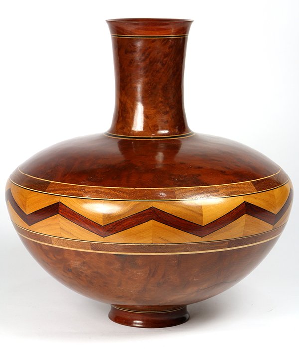 Warren Atkins redwood burlwood turned and inlaid vessel: Warren Atkins redwood burlwood turned and inlaid vessel, the ovoid form having a cylindrical neck continuing to the central geometric frieze executed in multiple wood species, and rising on a circular