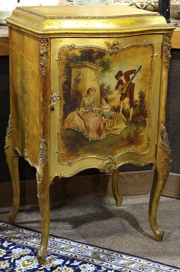 Louis XV style giltwood music cabinet: Louis XV style giltwood music cabinet, having a serpentine top above a single door accented with a Vernis Martin style scenic reserve, depicting Classical style figures including a musician, and risin
