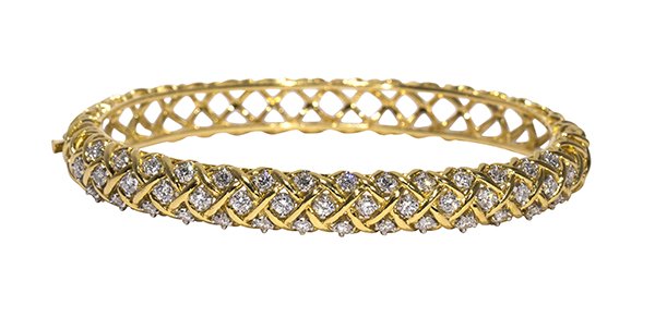McTeigue diamond, 18k yellow gold and platinum bangle: McTeigue diamond, 18k yellow gold and platinum bangle bracelet designed as a bracelet weave hinged bangle bracelet, set with full cut diamonds weighing in total approximately 2.01 cts., signed McTeigu