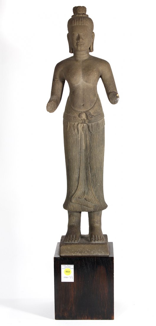 Cambodian Khmer-style Stone Sculpture: Cambodian Khmer-style stone figure, the male deity with braided hair in a top-knot, with a bare upper body and a dohti at the waist, with base, figure: 24.75"h