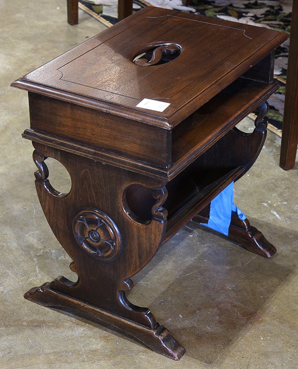 Combination stool and magazine rack in the Jacobean: Combination stool and magazine rack in the Jacobean taste, having a rectangular top centering a pierced integral handle in the shape of an 'S', above a shelf and a magazine holder, the lyre form sides