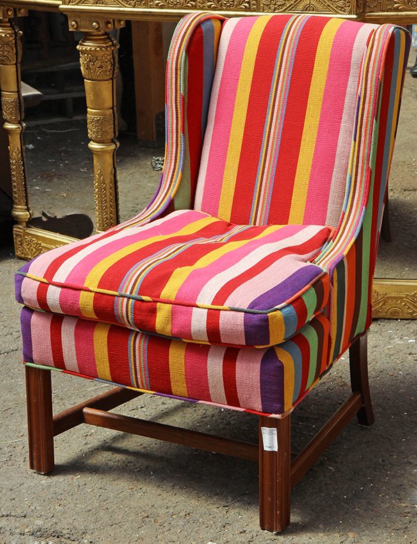 Moderne upholstered wingback chair, having polychrome (1 of 1)